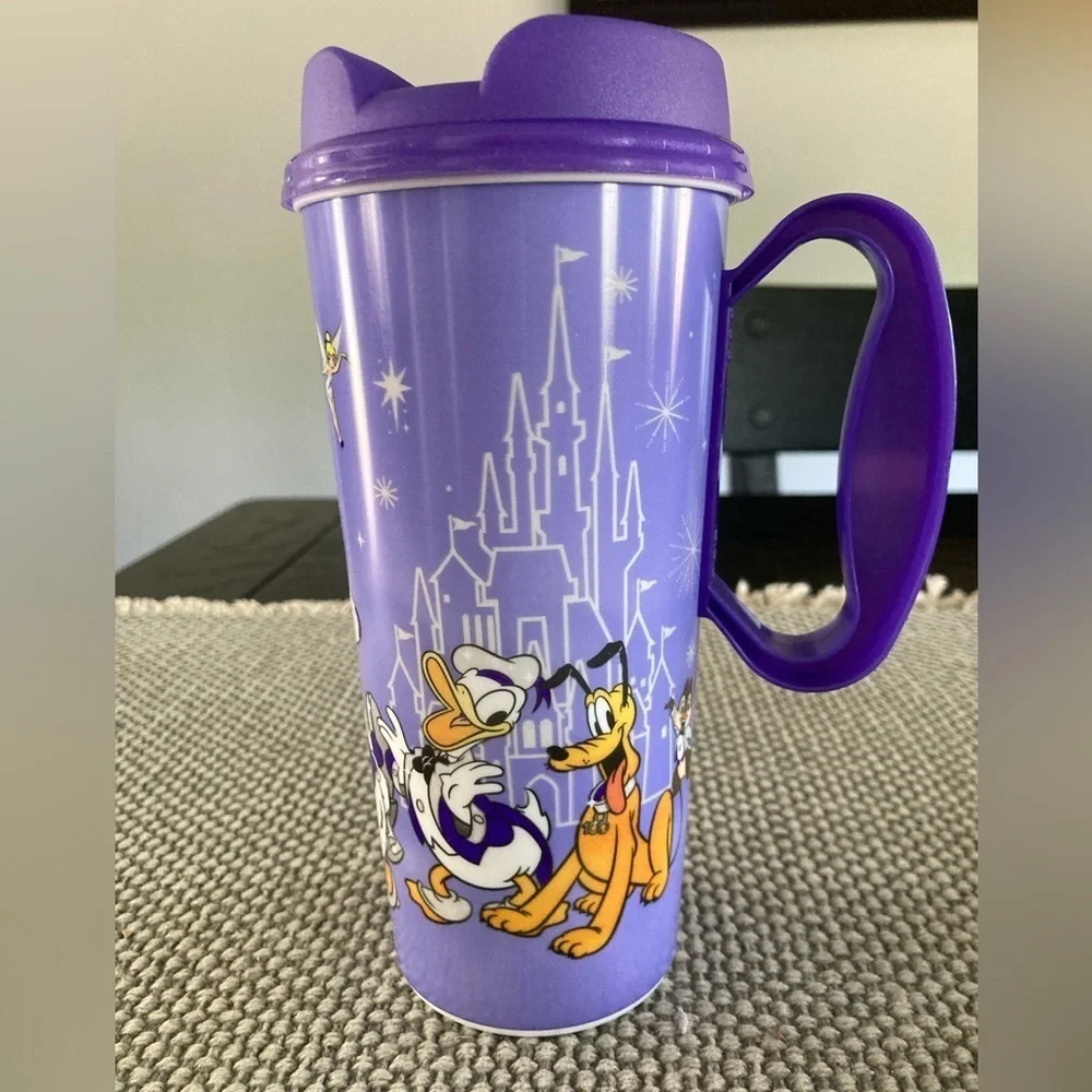 Disney 100 Year Wonder tumbler with lid for hot or cold drinks.